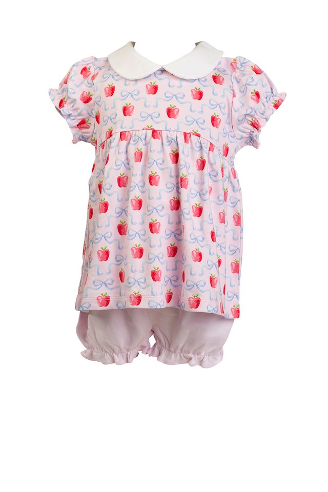 Dress your little one in the enchanting Apple Blossoms Bloomer Set by The Proper Peony. This delightful ensemble features charming apple and bow prints, complemented by a soft white Peter Pan collar. Crafted from luxurious Pima cotton, it offers unmatched comfort—perfect for those memorable first school days!