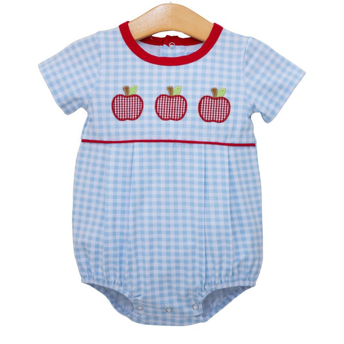 Brighten your little one’s day with the Apple Trio Bubble by Trotter Street Kids! This charming blue gingham bubble, decorated with playful red apple appliqués, adds a touch of fun and comfort to every outfit. Perfect for school days or playtime, it’s a delightful choice that sparks joy and style.