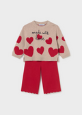 Cozy knit sweater and pants set from Mayoral featuring a playful hearts design. The soft, lightweight sweater pairs perfectly with coordinating pants for an effortless outfit that transitions from playtime to special occasions. Ideal for layering on cool fall and winter days, this two-piece set offers comfort and style in one coordinated look.