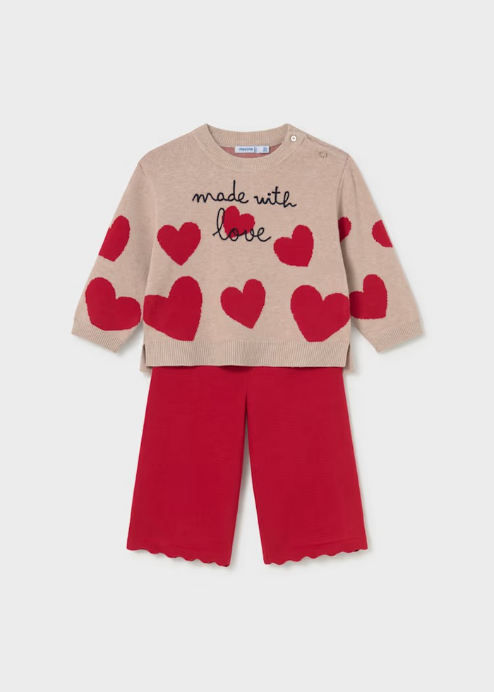 Cozy knit sweater and pants set from Mayoral featuring a playful hearts design. The soft, lightweight sweater pairs perfectly with coordinating pants for an effortless outfit that transitions from playtime to special occasions. Ideal for layering on cool fall and winter days, this two-piece set offers comfort and style in one coordinated look.