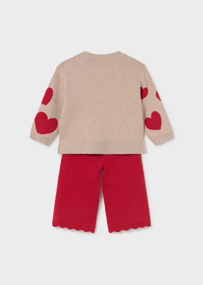 Cozy knit sweater and pants set from Mayoral featuring a playful hearts design. The soft, lightweight sweater pairs perfectly with coordinating pants for an effortless outfit that transitions from playtime to special occasions. Ideal for layering on cool fall and winter days, this two-piece set offers comfort and style in one coordinated look.