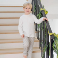 The Beckett Boys' Hangout Pant in Nutcracker Stripe by Lila &amp; Hayes offers comfort with a convenient drawstring waistband. Crafted from 100% Peruvian cotton, these pants are soft and durable. These pants make the perfect holiday loungewear!
