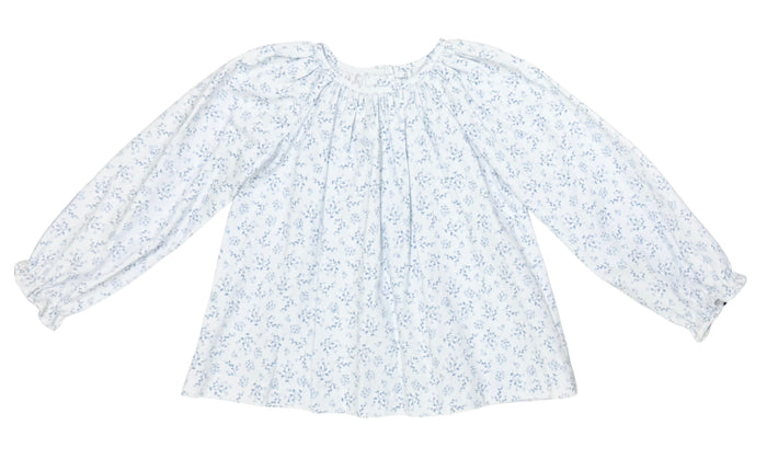 The Blue Blossom Elaine Blouse by Zuccini Kids brings joyful elegance to every moment. Its delicate blue floral pattern and charming ruffle neck collar add a touch of whimsy and grace, perfect for tween girls who want to shine with confidence and style.