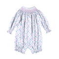 Delicate smocking adorns the neckline of this charming bubble, finished with a sweet bow detail. Soft floral print in calming blue tones creates an heirloom-quality piece perfect for special occasions or everyday elegance. The bishop bubble silhouette offers comfortable, timeless style for little ones.