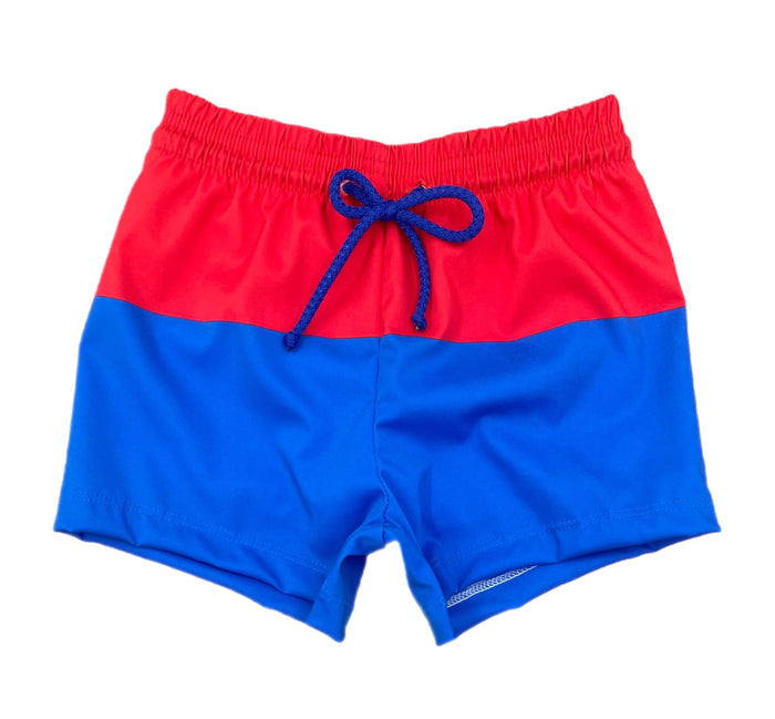 Celebrate your little one's love for their country with Boy's Patriotic James Swim Shorts from James &amp; Lottie. These classic blue and red block design swim shorts are perfect for showing off their patriotism in style this summer. Get ready for some fun in the sun with this stylish swimsuit!