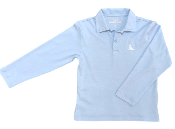 The Boys Basics Patton Long Sleeve Polo in Light Blue by James &amp; Lottie offers timeless style with soft cotton comfort. Featuring a charming puppy logo, this classic polo is perfect for fall and winter events where he needs to look sharp and feel cozy. Durable and easy to wear, it’s an ideal wardrobe staple that combines sophistication with everyday practicality.