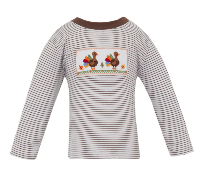 The Brown Striped Knit Turkey Smocked Tee by Anavini combines cozy comfort with charming detail. Its soft knit fabric and delicate turkey smocking create a festive look that embraces the warmth of Thanksgiving, making every moment with your toddler unforgettable!