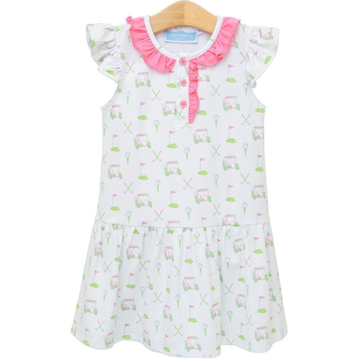 Introducing the Caddy Club Dress from Trotter Street Kids! This charming golf-printed knit dress features delightful ruffle sleeves and a playful drop hem, making it an ideal choice for spring and summer fun. With its breathable design and sweet pink trim, your little girl will feel both comfortable and stylish while enjoying her outdoor adventures. Embrace the joy of childhood with this delightful dress!