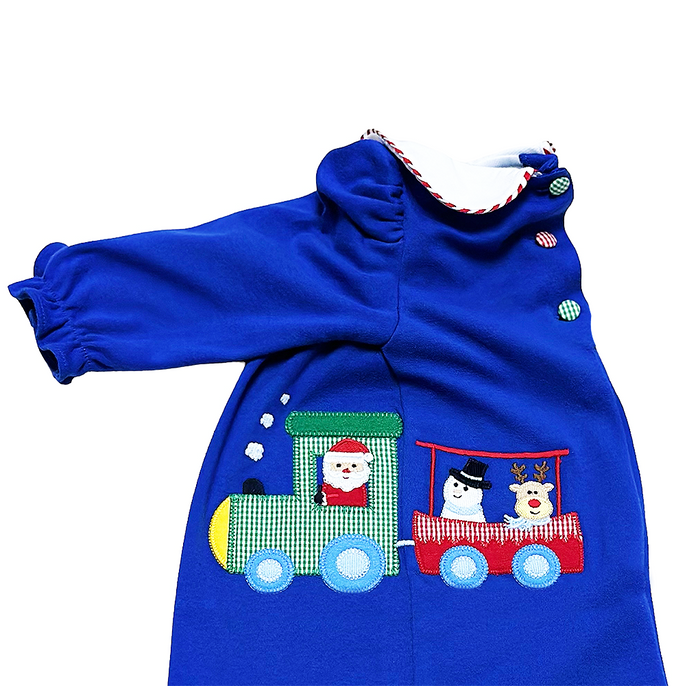 Introduce your little one to the magic of the holiday season with our Christmas Train Louisa Bubble from Zuccini Kids. Featuring a festive Christmas Train applique, a classic peter pan collar, and a cheerful vibrant blue color, this bubble is perfect for toddlers and brings joy to any occasion.&nbsp;