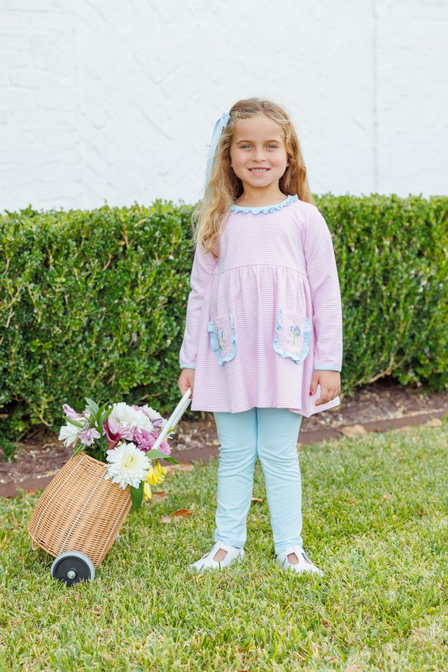 The Flower Bouquet Pant Set by Trotter Street Kids combines soft pink and white stripes with charming flower appliqués and light blue accents. Its cozy leggings and tunic with handy pockets create a delightful outfit that’s as playful as it is comfortable!