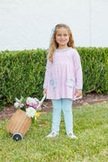 The Flower Bouquet Pant Set by Trotter Street Kids combines soft pink and white stripes with charming flower appliqués and light blue accents. Its cozy leggings and tunic with handy pockets create a delightful outfit that’s as playful as it is comfortable!