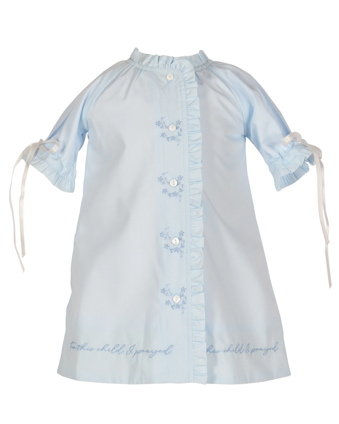 This daygown is an expression of faith and answered prayers.  The scripture "For this child I prayed" is embroidered around the hem of this classic broadcloth daygown.  Delicate embroideries, ruffles, ribbons and mother of pearl button closures go down the front, fully lined.