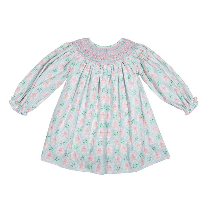 Hand-smocked bishop dress in a charming gingerbread print, crafted from a soft cotton blend. Long sleeves and timeless smocking detail create an heirloom-quality piece perfect for special occasions or everyday elegance. By Shop Teeta.