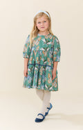 Pink Chicken’s Girls Maribelle Dress in Green Butterflies brings playful elegance to every twirl. The delicate butterfly print and navy velour ribbon trim create a charming look that delights and inspires confidence in every step. Perfect for joyful moments and unforgettable memories!