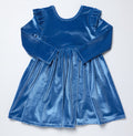 Pink Chicken’s Girls Natalie Dress in bright blue velour brings warmth and vibrant color to every fall day. Its soft, luxurious fabric and playful drop hem create effortless movement, making it an irresistible choice for girls who love comfort and style from toddler to tween.