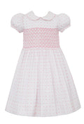 Elevate your little girl's summer wardrobe with our Girls Pink &amp; White Dotted Plumeti Dress. With a smocked bodice and delicate hot pink dots on a crisp white background, this dress exudes timeless style and charm. Perfect for any occasion, its classic plumeti fabric is sure to make her stand out.