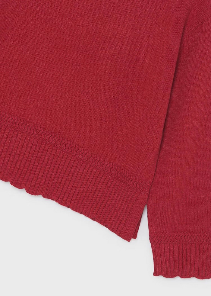 Introduce your daughter to timeless elegance with this Girls Scallop Hem Sweater from Mayoral. Crafted in a classic red hue, this piece combines everyday wearability with feminine charm. The signature scalloped hemline adds a whimsical touch that sets it apart—perfect for layering over collared shirts or pairing with school uniforms. Ideal for girls and tweens seeking a versatile staple that bridges casual and dressy occasions.