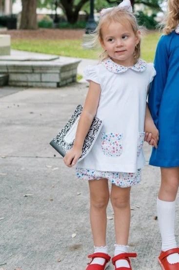 A sweet choice for the school season, our Blessings Bloomer Set features a soft Legacy White knit top with a classic Peter Pan collar and adorable front pockets in our Homeroom Blooms print.

Paired with coordinating bloomers or shorts this timeless set is perfect for back-to-school days and making memories all year long.