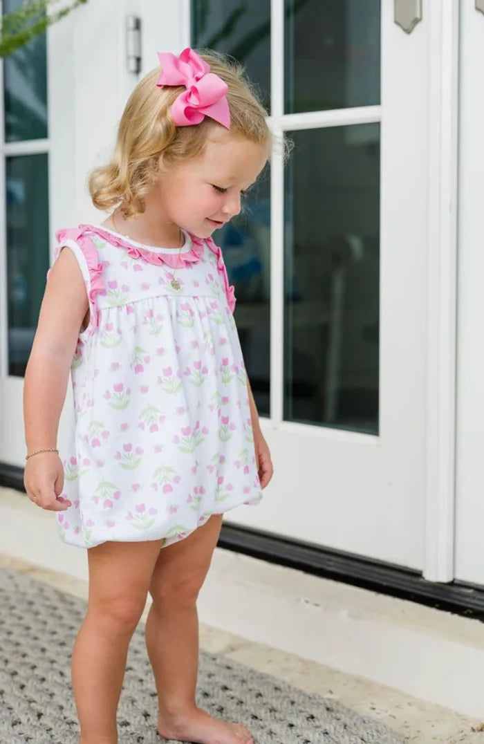 Dress your little girl in the enchanting Knit Tulip Bubble by James and Lottie. This charming piece features a delightful tulip knit print and a playful pink ruffle trim, making it perfect for warm spring and summer days. Plus, matching outfits for older siblings add to the fun! Embrace the joy of coordinating family looks!