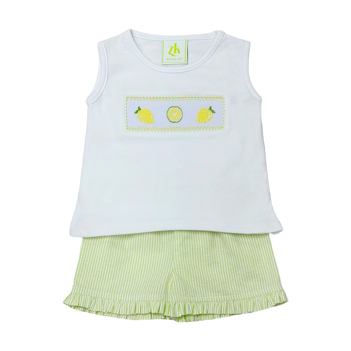 Get your little one ready for summer with the Lemon Blair Smocked Short Set from Zuccini Kids! This adorable set features a knit top with smocked lemon details for a touch of sweetness. The coordinating lime green and white seersucker ruffle edge shorts add a pop of color and summer vibes.!