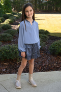 The Luna Skirt in Slate from Pleat offers a dazzling tiered design that adds sparkle to every step. Perfectly crafted for tween girls, this skirt pairs effortlessly with the Jane Textured Sweatshirt Top or Wren Top in Dashing, creating a stylish and versatile outfit. Its shimmering fabric makes it ideal for special occasions or everyday wear, giving your child a confident and playful look.