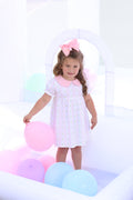 Celebrate every moment with the Party Time Dress by Trotter Street Kids! Featuring a delightful pink balloon pattern and a charming Peter Pan collar, this comfortable and breathable knit dress is perfect for birthday festivities. Let your little one shine bright and create joyful memories in style!