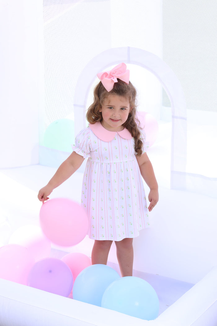 Celebrate every moment with the Party Time Dress by Trotter Street Kids! Featuring a delightful pink balloon pattern and a charming Peter Pan collar, this comfortable and breathable knit dress is perfect for birthday festivities. Let your little one shine bright and create joyful memories in style!