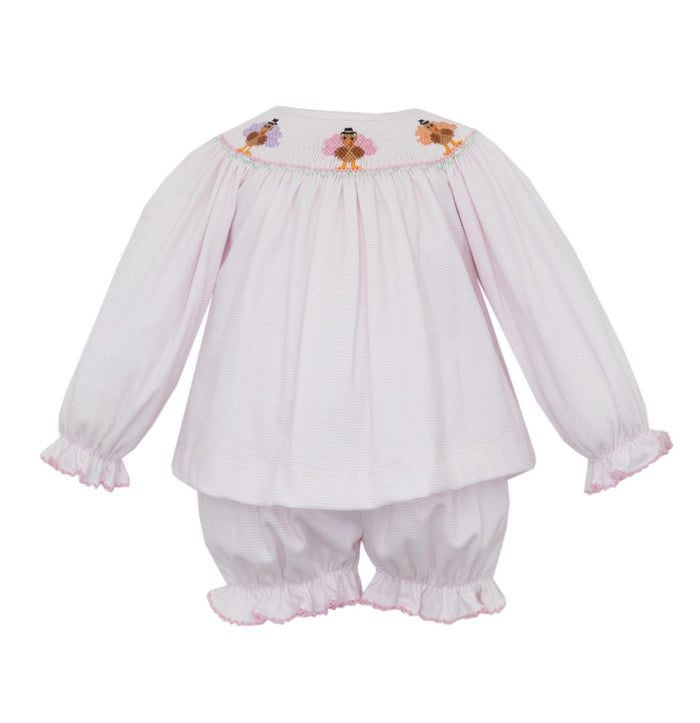 Celebrate Thanksgiving in style with the Pink Knit Stripe Turkey Bishop Set by Petit Bebe. Soft pink stripes and delicate turkey smocking create an adorable, cozy ensemble, perfectly paired with matching knit bloomers for your toddler girl’s comfort and charm on this special day!