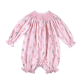 Baby Loren’s Pink Nutcracker Hand Smocked Pima Bishop Bubble wraps your little one in the softest Pima cotton, accented with delicate pink smocking and a charming nutcracker print. This exquisite bubble dress blends comfort and timeless holiday magic perfectly!