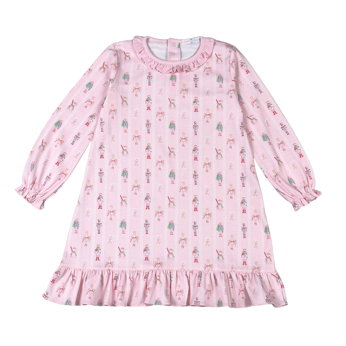 Baby Loren’s Pink Nutcracker Pima Dress wraps your toddler in soft, breathable Pima cotton, blending cozy comfort with festive charm. Perfect for holiday play or relaxing moments, this delightful dress adds a touch of joyful warmth to every Christmas celebration.