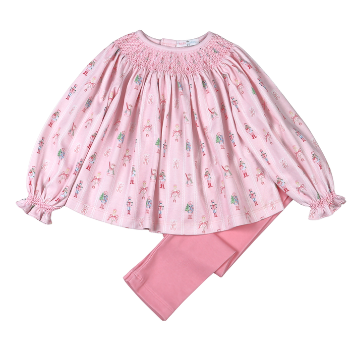 Celebrate the magic of the season with Baby Loren’s Pink Nutcracker Pima Pants Set. The delicate pink nutcracker top, detailed with charming smocking, pairs perfectly with soft pink leggings—comfort and festive style wrapped into one joyful outfit for your little girl’s holiday moments!