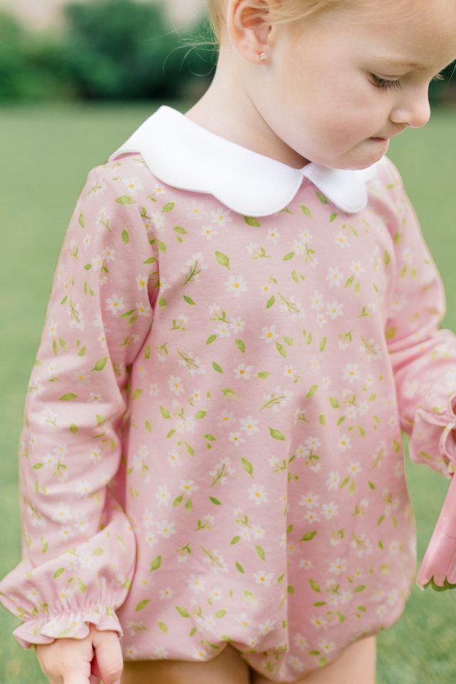 Wrap your little girl in the charm of autumn with the Pink Petal Bubble by The Proper Peony. Its delicate pink floral print and soft white petal float collar create an enchanting look that’s as cozy as it is beautiful!