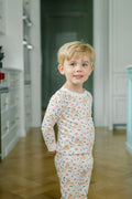 The Proper Peony’s Prancer Pima Pajama Set wraps your little one in soft, breathable Pima cotton, featuring charming reindeer and candy cane prints that bring festive joy to Christmas mornings. Cozy, cute, and perfect for holiday memories that last a lifetime!