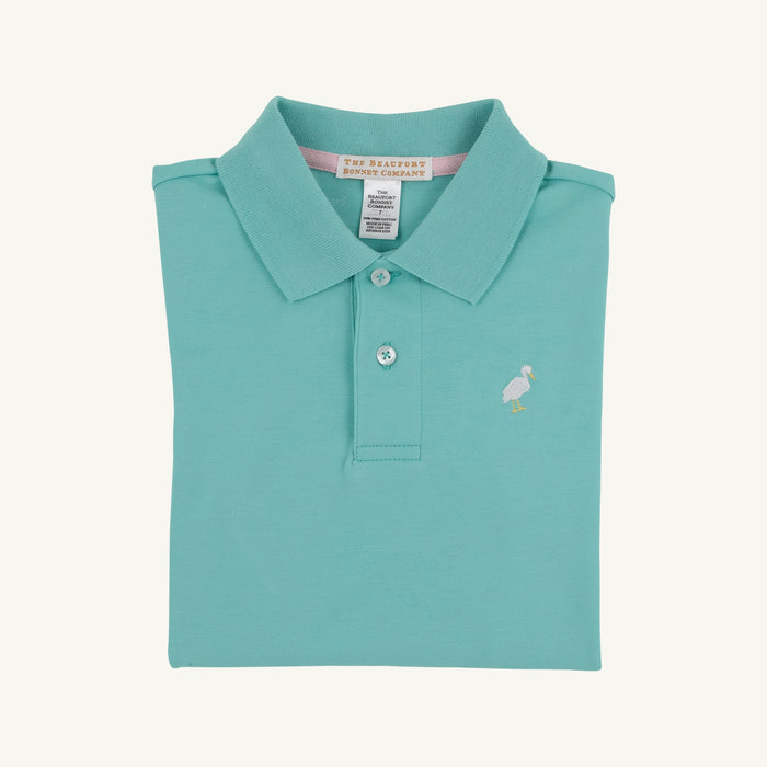 Dress your little one in the delightful Prim and Proper Polo in Turks Teal by The Beaufort Bonnet Company! Made from soft Pima cotton, this vibrant polo adds a touch of elegance to any spring or summer outing. Make every moment special with a shirt that’s both comfortable and stylish!