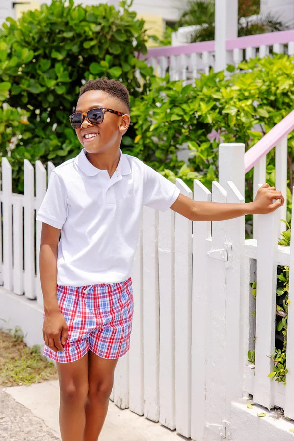 Elevate your child's wardrobe with the Prim and Proper Polo in Worth Ave White from The Beaufort Bonnet Company. Crafted from soft Pima cotton, this classic white polo features the iconic TBBC stork, making it both stylish and comfortable. A timeless staple perfect for spring and summer!