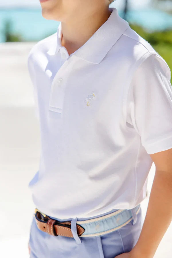Elevate your child's wardrobe with the Prim and Proper Polo in Worth Ave White from The Beaufort Bonnet Company. Crafted from soft Pima cotton, this classic white polo features the iconic TBBC stork, making it both stylish and comfortable. A timeless staple perfect for spring and summer!