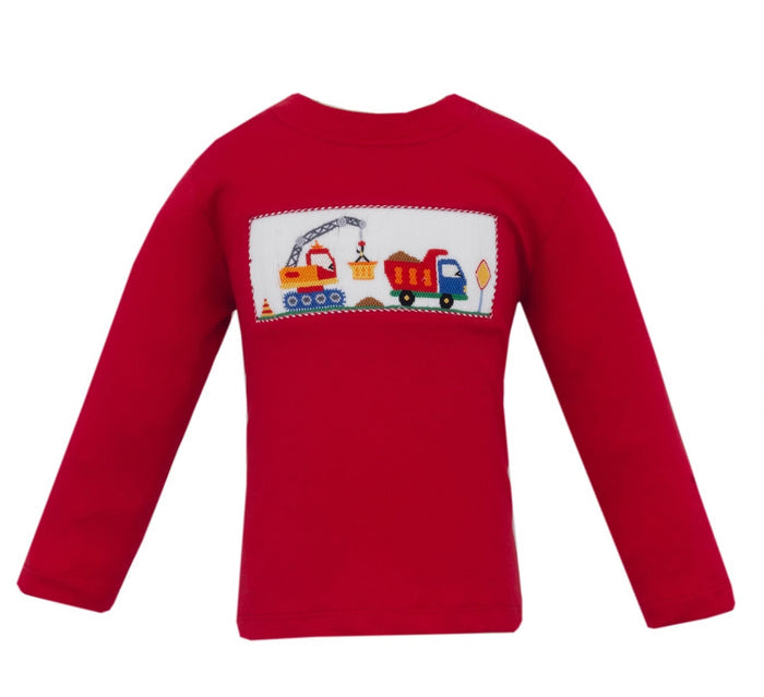 Anavini’s Red Knit Construction Trucks Smocked Tee brings vibrant energy to your toddler’s wardrobe. The soft red knit and charming construction truck smocking add playful charm, making it perfect for little builders ready to explore with comfort and style.