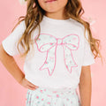 Elevate your little girl's wardrobe with this charming Sky Blue Floral Bow Patch Short Sleeve T-Shirt from Sweet Wink. The crisp white base showcases an eye-catching appliqué design featuring a delicate bow and vibrant floral print that captures playful sophistication. This versatile tee pairs beautifully with the coordinating Sky Blue Floral Pleated Skirt to create an effortless athleisure ensemble.