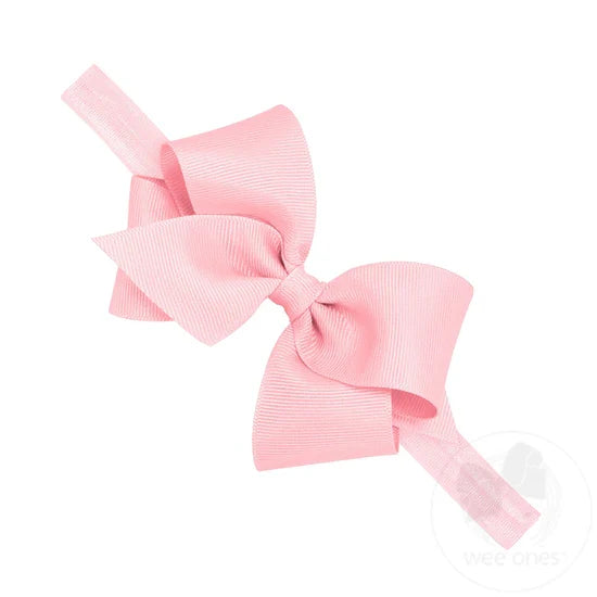 The Small Classic Grosgrain Girls Hair Bow on Baby Headband by Wee Ones is now perfect for your baby girl after adding it to this matching soft elastic band. Available in light pink and white.