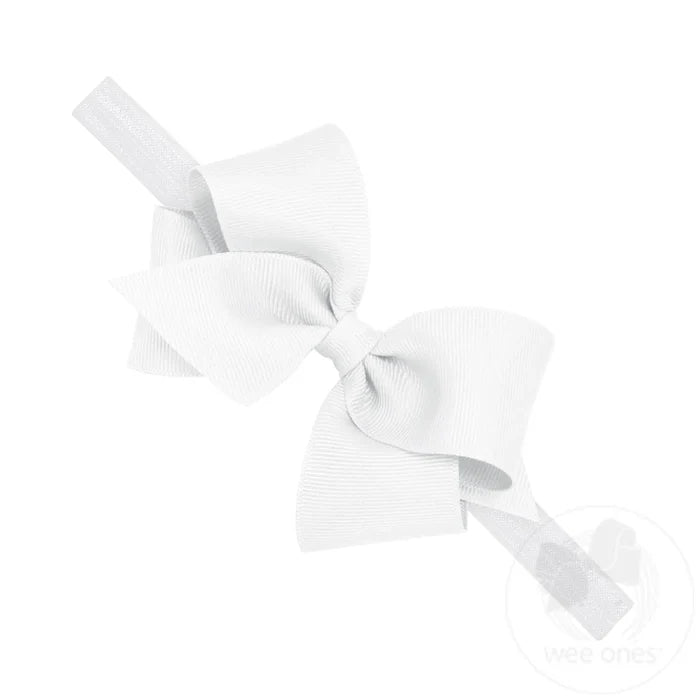 The Small Classic Grosgrain Girls Hair Bow on Baby Headband by Wee Ones is now perfect for your baby girl after adding it to this matching soft elastic band. Available in light pink and white.