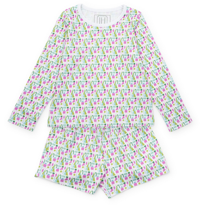 Keep her cozy and stylish this holiday with the Sophie Girls' Lounge Short Set in Mod Holiday Pink by Lila &amp; Hayes. This two-piece set features a long-sleeve top paired with comfortable shorts, designed for relaxed yet vibrant loungewear. The fun retro-inspired print adds a playful touch, making it perfect for festive gatherings or cozy days at home. Let her shine this season with a look that’s as cheerful as it is comfortable.
