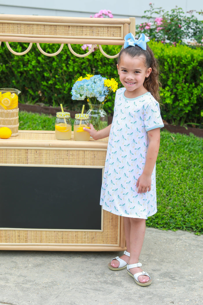 Embrace sunshine and joy with the Squeeze the Day Dress by Trotter Street Kids! Featuring a delightful lemon pattern, this comfortable, breathable knit dress is perfect for carefree days in spring and summer. Let your little one radiate happiness and confidence wherever she goes!