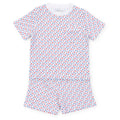 Experience the ultimate comfort and style with our Star Spangled Charles Pajama Short Set from Lila &amp; Hayes. Made from soft cotton material, this set includes a short sleeve shirt and coordinating shorts, adorned with fun red and blue stars. Perfect for a cozy night's sleep or lounging around in style.