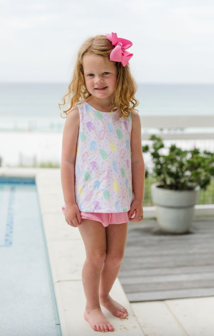 Embrace sunny days with the Sweet Summertime Sammy Bloomer Set by James and Lottie! This adorable outfit features a playful popsicle print on a cozy knit top paired with soft pink shorts, making it ideal for all summer adventures. Dress your little one in vibrant style and comfort!