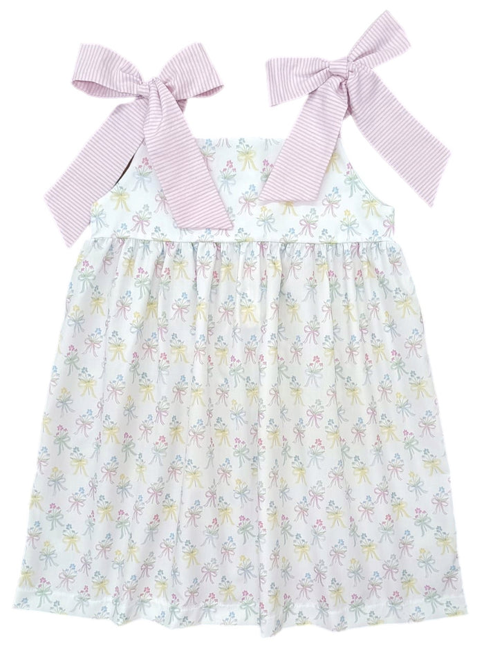 Indulge in the beauty of nature with Thea Flower Bouquet Dress from James &amp; Lottie! Adorned with floral bouquets and cute bows, this dress exudes a sense of elegance. The pink and white seersucker ties on the shoulders add a charming touch. Perfect for any occasion, this dress will make you feel like a blooming flower!