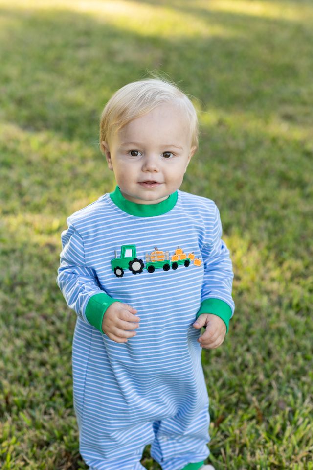 Dress your little one in the Tractor Trail Romper by Trotter Street Kids, where cozy stripes meet playful tractor and pumpkin details. This charming romper, with its soft green accents, keeps your infant warm and adorable on every crisp fall day!