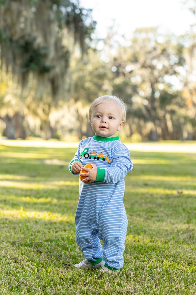 Dress your little one in the Tractor Trail Romper by Trotter Street Kids, where cozy stripes meet playful tractor and pumpkin details. This charming romper, with its soft green accents, keeps your infant warm and adorable on every crisp fall day!