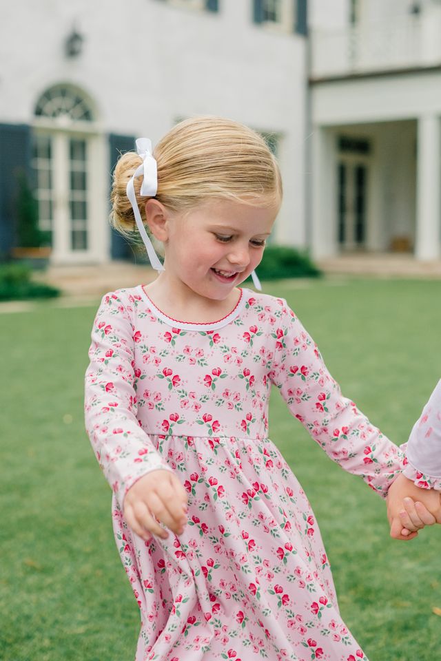 The Proper Peony’s Zinnia Blooms Twirl Dress delights with vibrant floral prints on soft Pima cotton, offering cozy comfort and twirl-worthy style for toddler girls. Perfect for winter holidays, it brings joy and charm to every special moment with effortless grace.