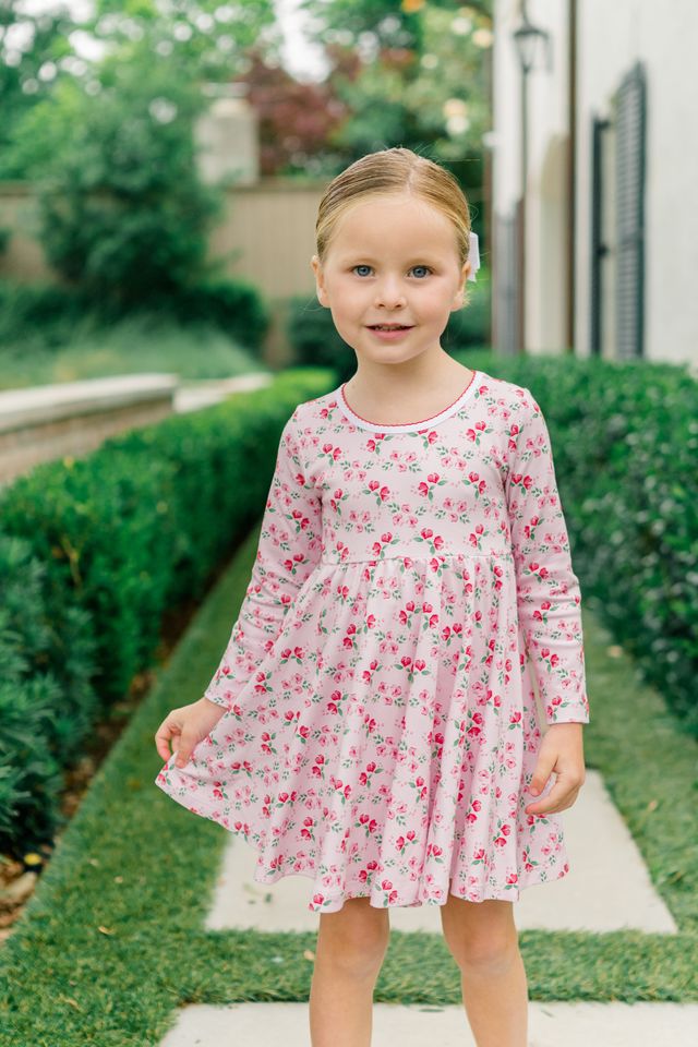 The Proper Peony’s Zinnia Blooms Twirl Dress delights with vibrant floral prints on soft Pima cotton, offering cozy comfort and twirl-worthy style for toddler girls. Perfect for winter holidays, it brings joy and charm to every special moment with effortless grace.